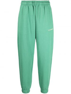 Jednofarebné bavlnené teplákové nohavice Monochrome zelená