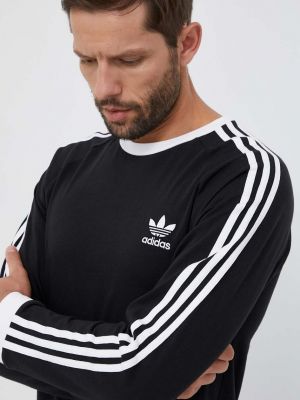 Смугастий бавовняний лонгслів з аплікацією Adidas Originals чорний