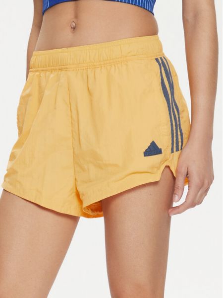 Relaxed спортни шорти на райета Adidas жълто