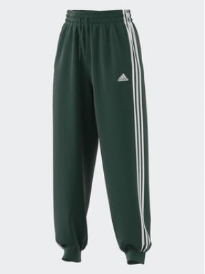 Смугасті спортивні штани вільного крою Adidas зелені
