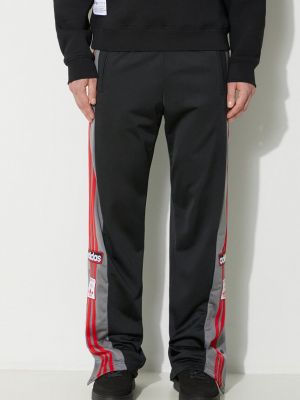 Spodnie sportowe na zamek z kieszeniami na guziki Adidas Originals czarne
