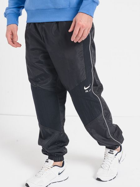 Спортивные штаны свободного кроя с карманами Nike черные