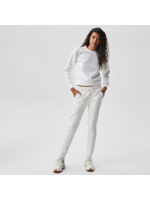 Белые спортивные штаны Lacoste