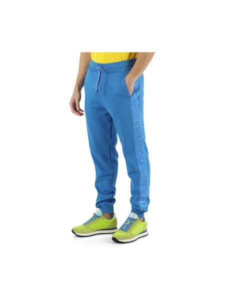 Spodnie sportowe Moschino niebieskie