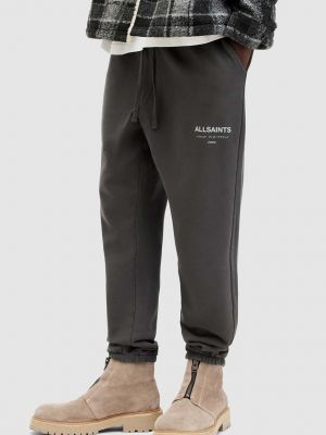 Bavlněné sportovní kalhoty s potiskem Allsaints šedé