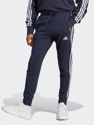 Pruhované priliehavé teplákové nohavice Adidas modrá