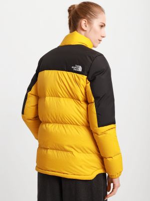 Нейлоновая куртка The North Face желтая