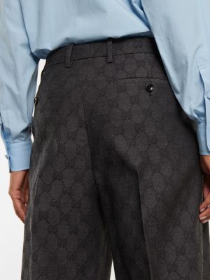 Vlnené nohavice Gucci sivá