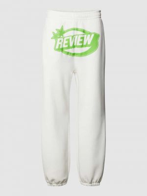 Spodnie sportowe z nadrukiem Review białe