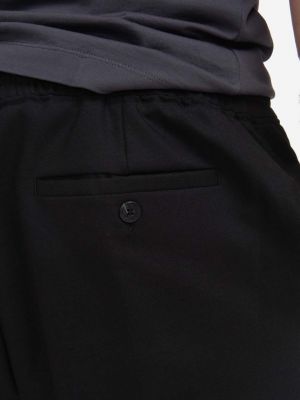 Jednobarevné kalhoty Neil Barrett černé