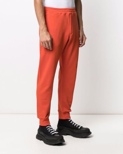 Sportovní kalhoty s potiskem Alexander Mcqueen oranžové