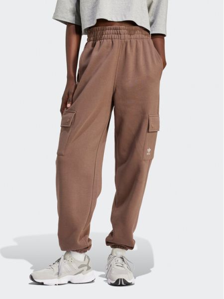 Voľné priliehavé teplákové nohavice Adidas hnedá