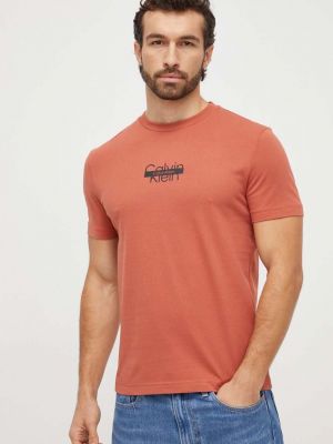 Памучна тениска с дълъг ръкав с принт Calvin Klein оранжево
