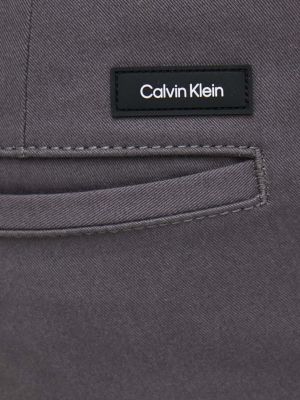 Přiléhavé kalhoty Calvin Klein šedé
