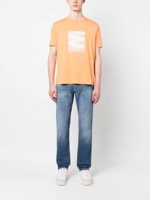 Bavlněné tričko s potiskem Emporio Armani oranžové
