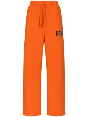 Bavlnené teplákové nohavice s potlačou Dolce & Gabbana oranžová