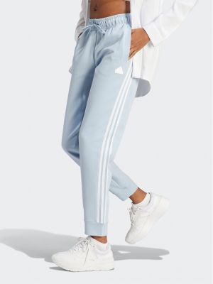Pruhované priliehavé teplákové nohavice Adidas modrá