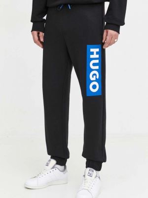 Bavlněné sportovní kalhoty s potiskem Hugo Blue