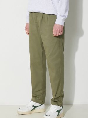 Jednobarevné kalhoty New Balance zelené