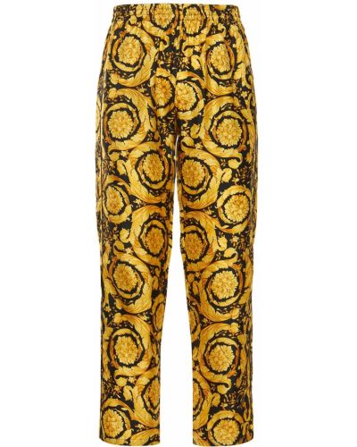 Pantalones de seda con estampado Versace