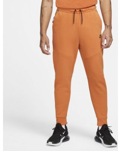 Joggery męskie Nike Sportswear Tech Fleece - Pomarańczowy