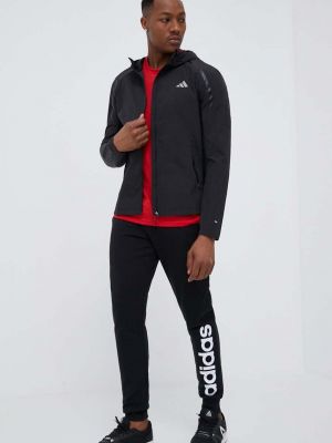 Spodnie sportowe bawełniane z nadrukiem Adidas czarne