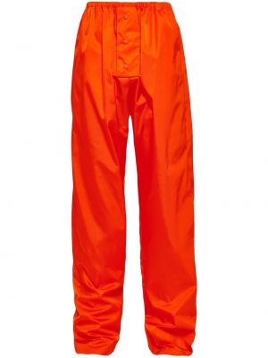 Sportovní kalhoty z nylonu Prada oranžové