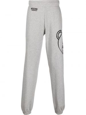 Pantaloni con stampa Moschino grigio