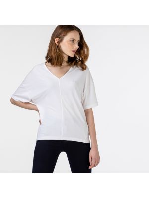 Белая блузка Lacoste