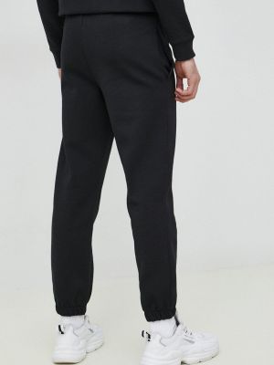 Melanžové sportovní kalhoty Lacoste černé