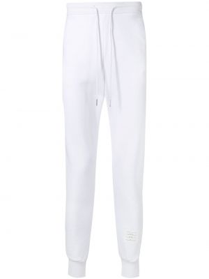 Pantalon de joggings à rayures Thom Browne blanc