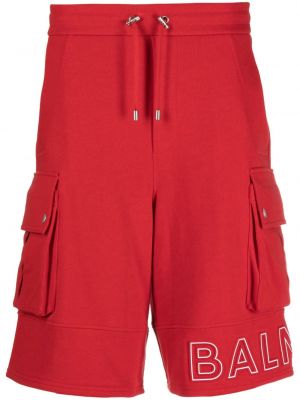 Bavlnené šortky cargo s potlačou Balmain červená