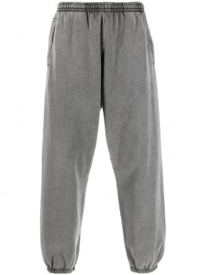 Bavlněné sportovní kalhoty Acne Studios šedé