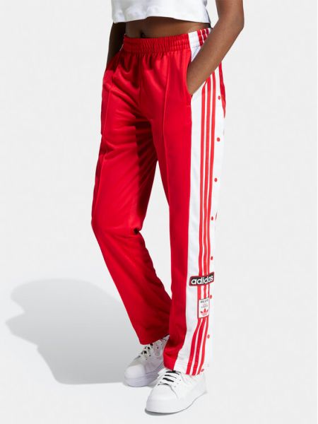 Priliehavé teplákové nohavice Adidas červená
