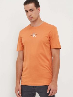 Koszulka z nadrukiem Calvin Klein Jeans pomarańczowa