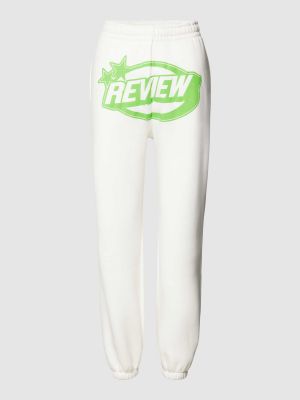 Spodnie sportowe z nadrukiem Review białe