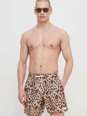 Pantaloni cu dungi cu imagine cu imprimeu animal print Adidas