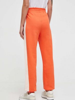 Pantaloni sport din bumbac Roxy portocaliu
