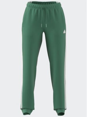 Pruhované priliehavé teplákové nohavice Adidas zelená