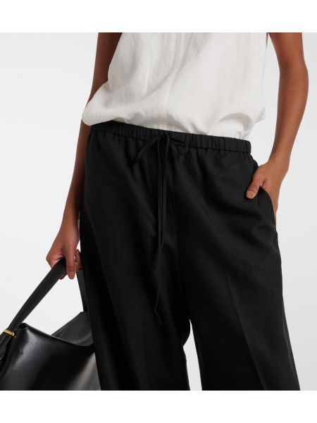 Lněné kalhoty z lyocellu relaxed fit Totême černé