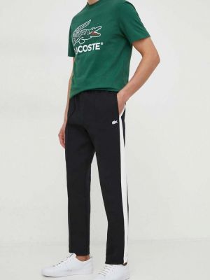 Sportovní kalhoty s aplikacemi Lacoste černé