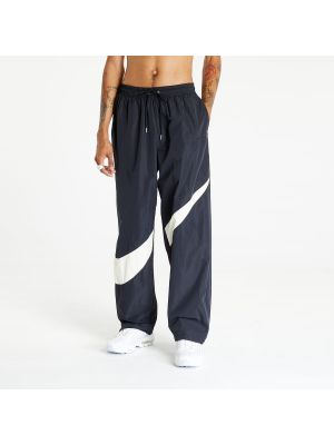 Pletené kalhoty z nylonu Nike černé