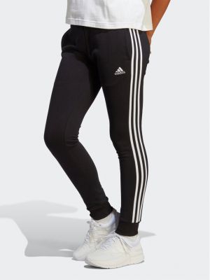 Pruhované slim fit sportovní kalhoty Adidas černé