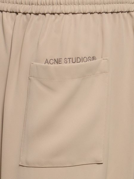 Kalhoty Acne Studios béžové
