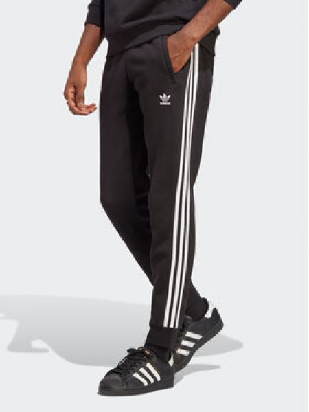 Pruhované přiléhavé sportovní kalhoty Adidas černé
