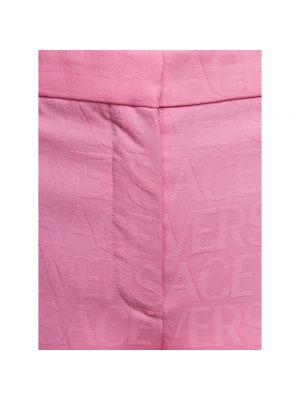 Spodnie Versace różowe