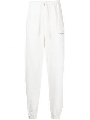 Spodnie sportowe bawełniane z nadrukiem Ih Nom Uh Nit białe