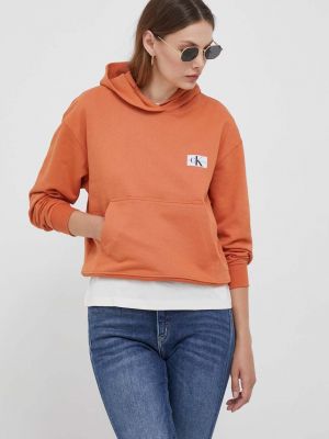 Bluza z kapturem bawełniana Calvin Klein Jeans pomarańczowa