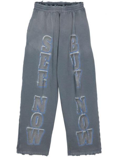 Bavlnené teplákové nohavice s potlačou Balenciaga modrá