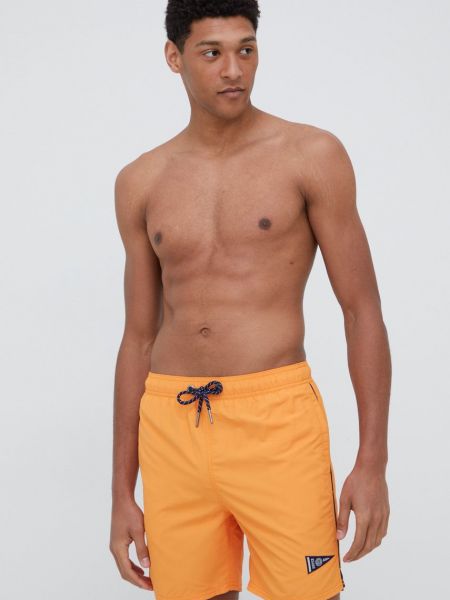Pantaloni Superdry portocaliu